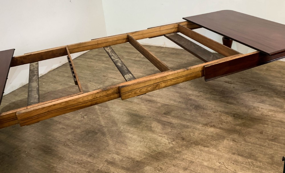 A superb Early Victorian Mahogany Extending dining Table with 3 leaves seat 14 View XIX