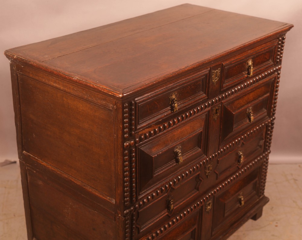 A 17th century moulded front chest of drawers in Oak View V