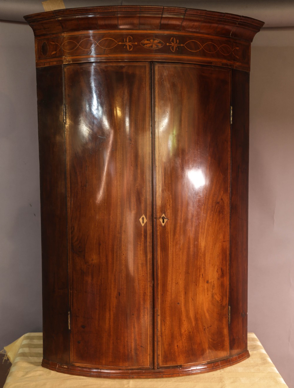 A Georgian Bow Front Corner cupboard Mahogany Inlaid