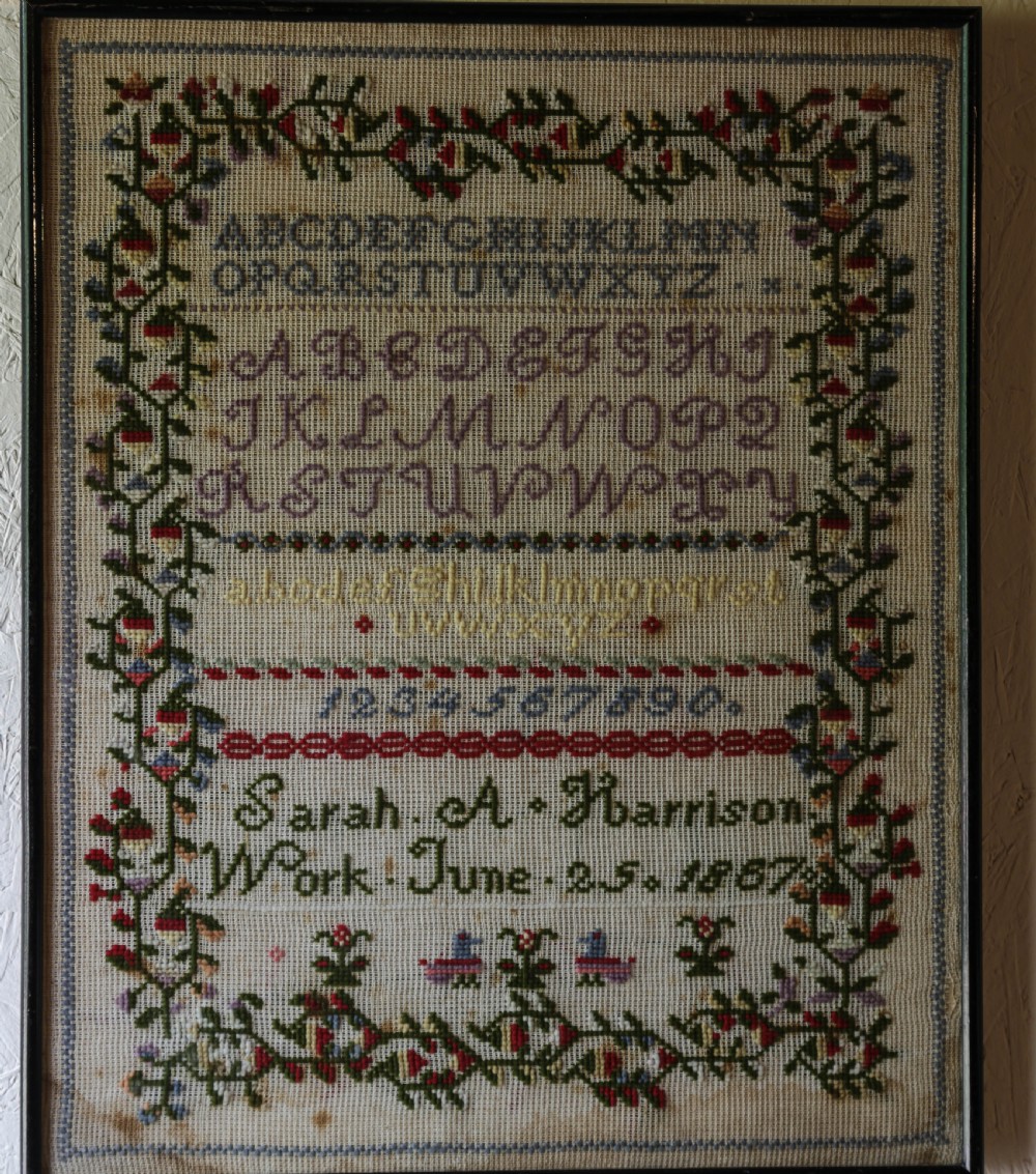 A Needlework Sampler by Sarah A Harrison June 25th 1887