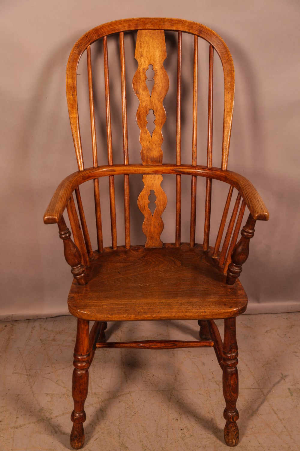 A Victorian High Back Windsor chair stick arm