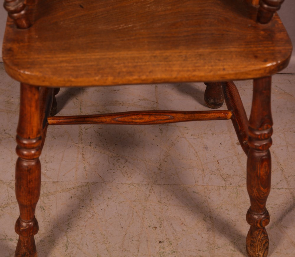 A Victorian High Back Windsor chair stick arm View II