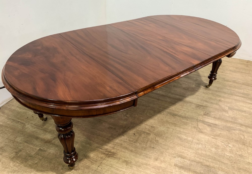 A Good Victorian mahogany Wind out Dining Table seats 10 View III