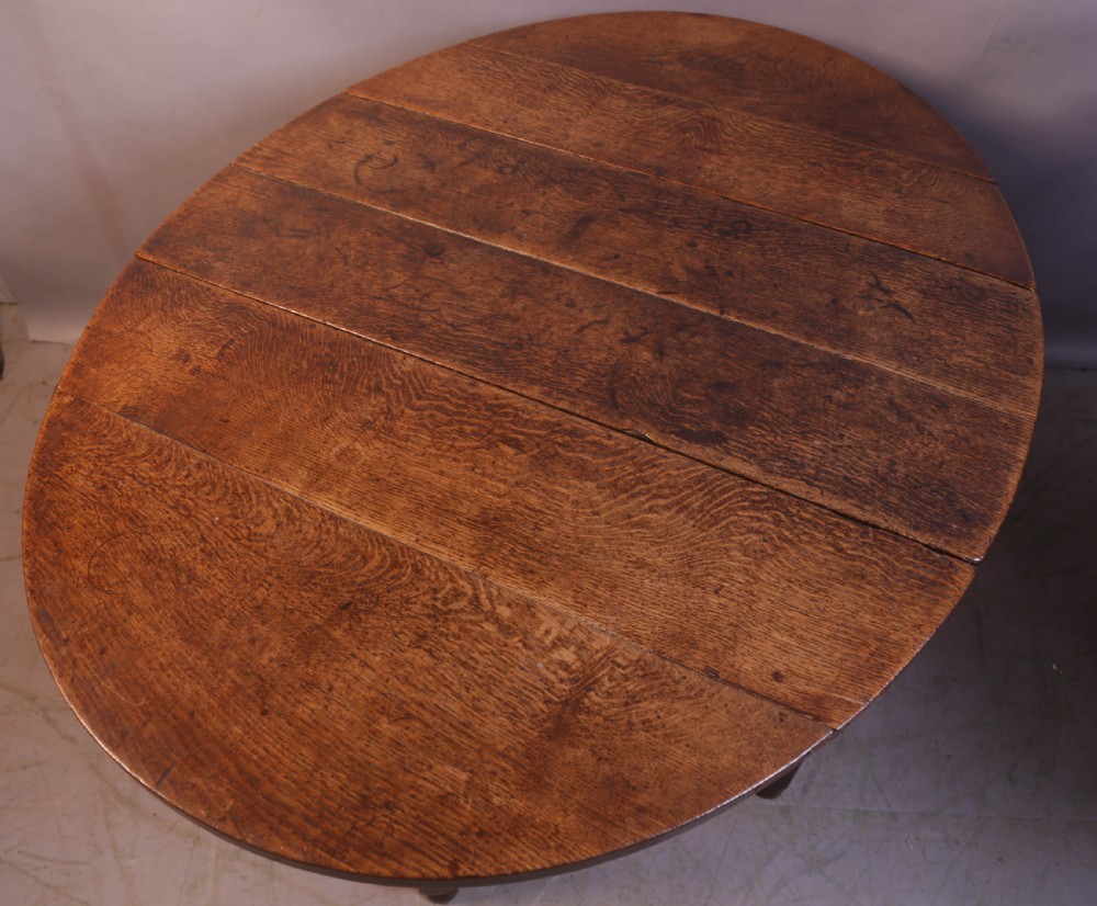Seventeenth-century oak gateleg table featuring drop-leaf flaps, turned legs, and stretchers. View V