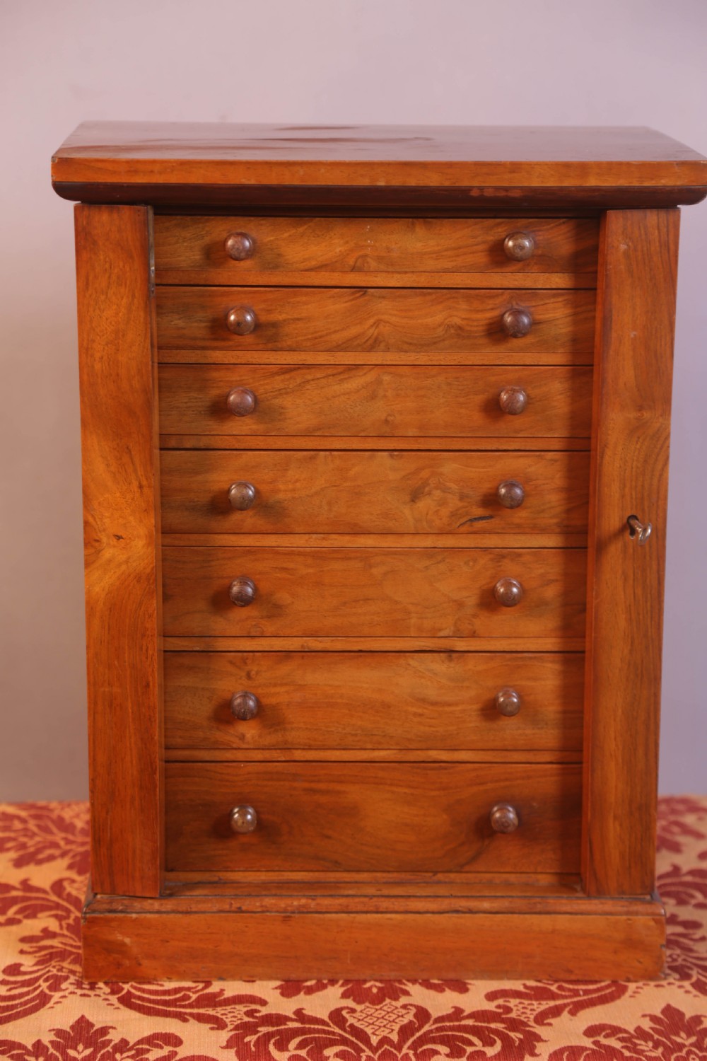 A Miniature Wellington Chest in Walnut