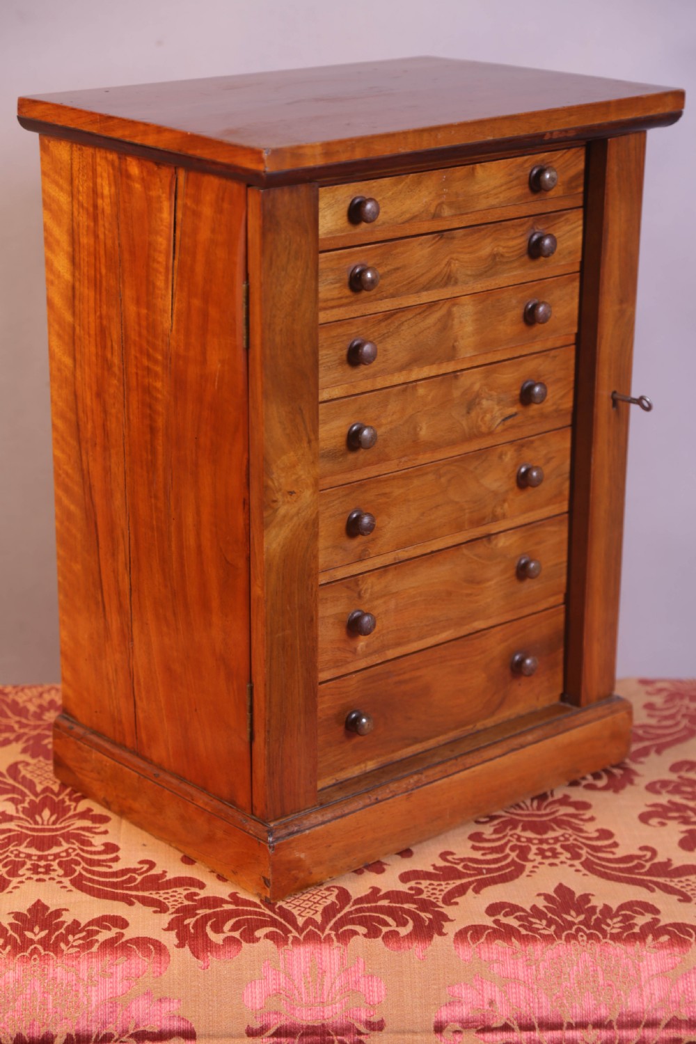 A Miniature Wellington Chest in Walnut View V
