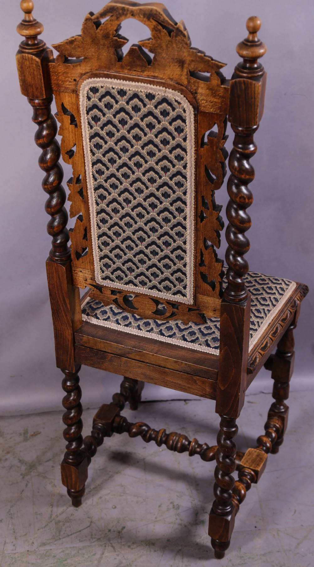 A set of six Victorian carved dining chairs featuring tall backs, barley twist uprights, and patterned upholstered seats. View VII