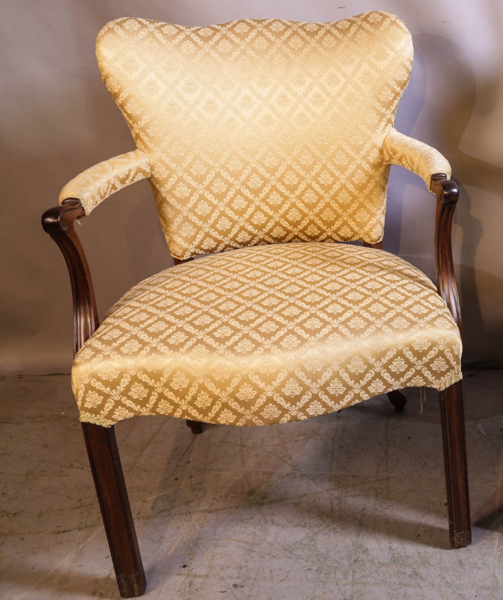 A pair of Georgian period mahogany armchairs upholstered in gold pattern damask fabric with swept timber arms. View II