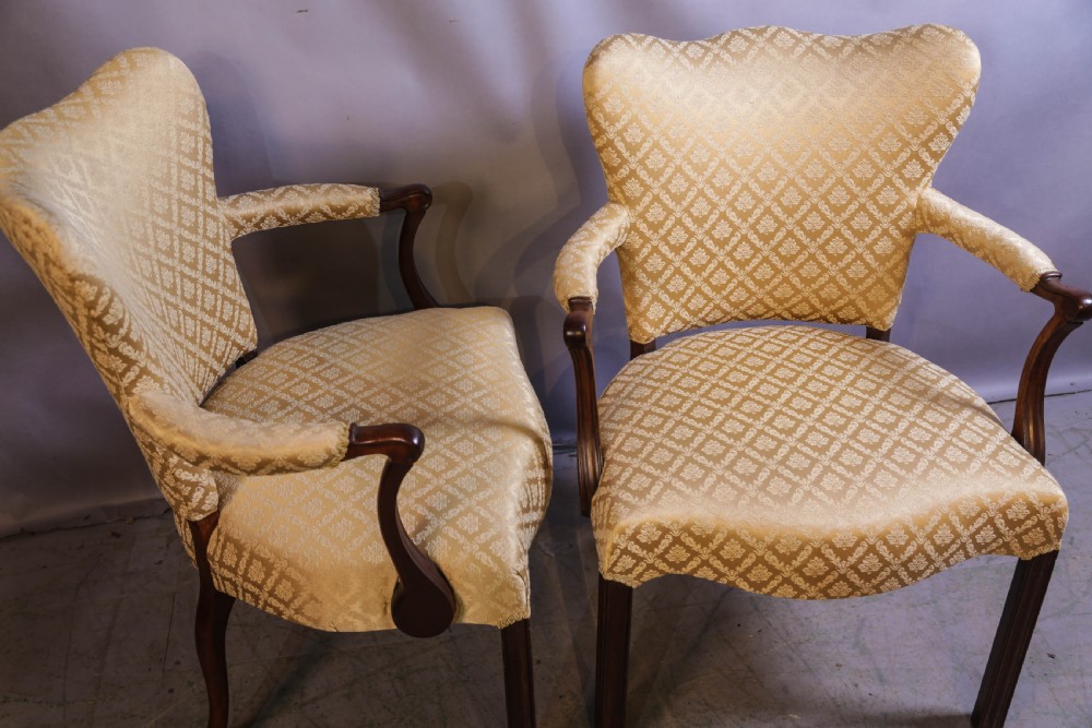 A pair of Georgian period mahogany armchairs upholstered in gold pattern damask fabric with swept timber arms. View III
