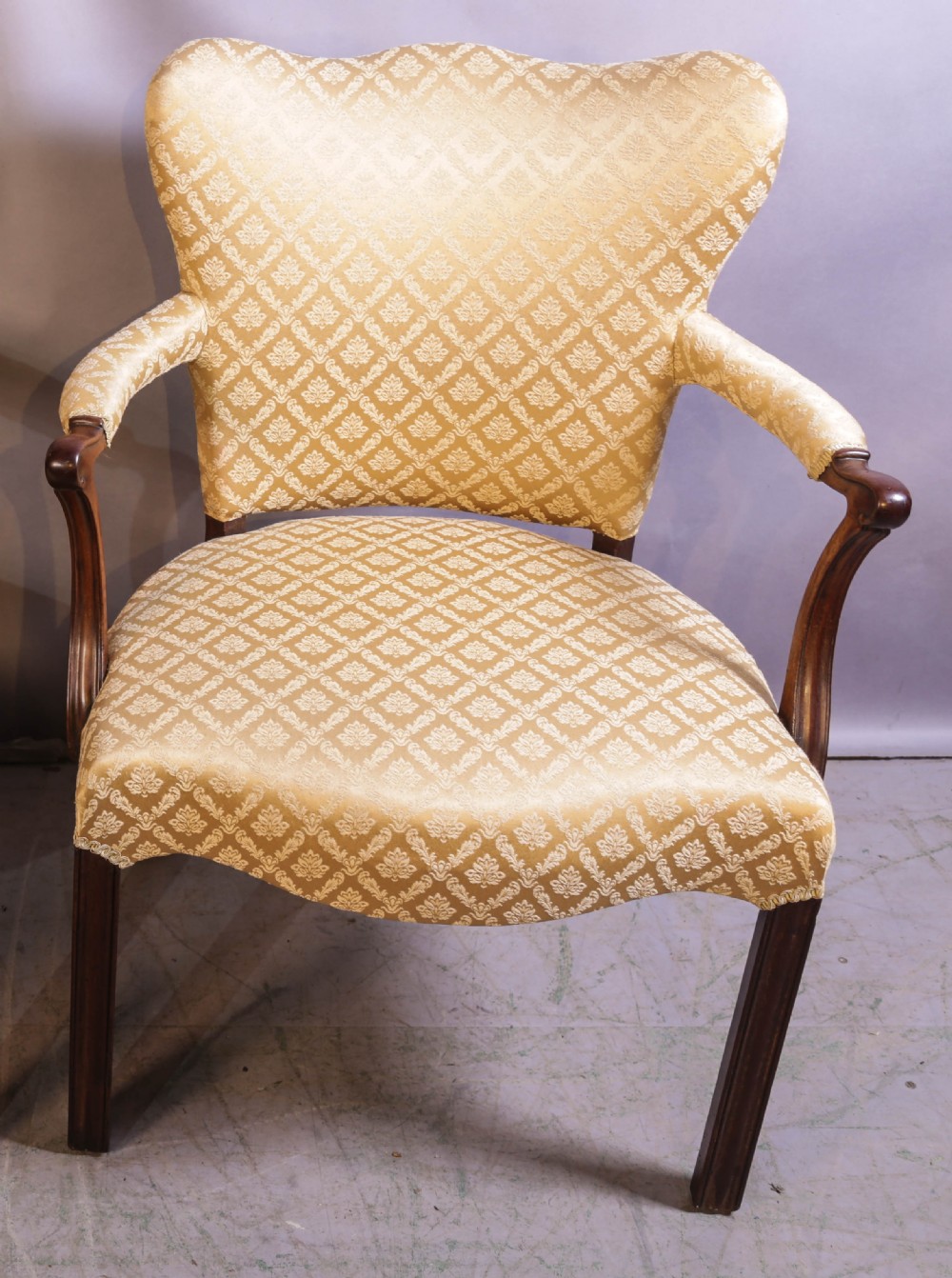 A pair of Georgian period mahogany armchairs upholstered in gold pattern damask fabric with swept timber arms. View IV