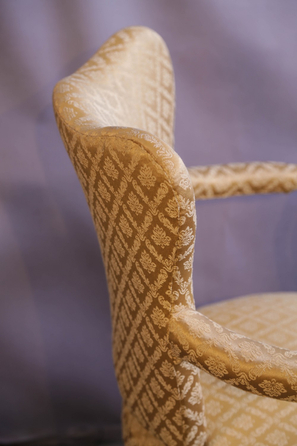 A pair of Georgian period mahogany armchairs upholstered in gold pattern damask fabric with swept timber arms. View IX