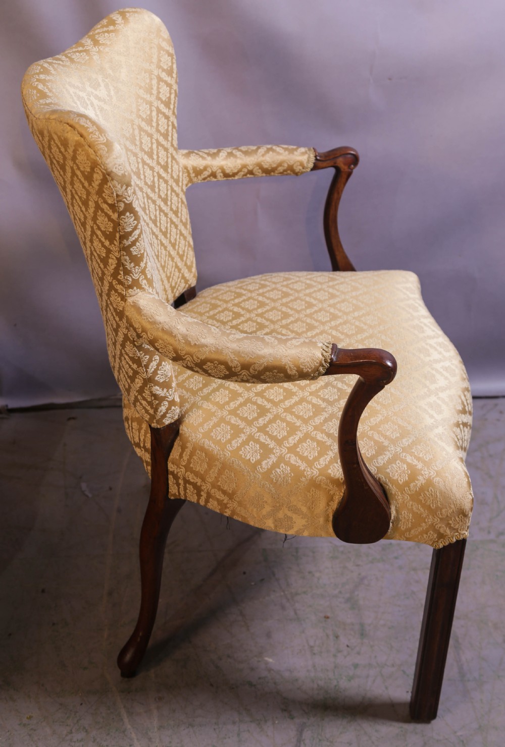 A pair of Georgian period mahogany armchairs upholstered in gold pattern damask fabric with swept timber arms. View XI