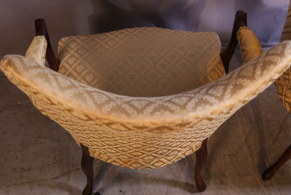 A pair of Georgian period mahogany armchairs upholstered in gold pattern damask fabric with swept timber arms. View XIII