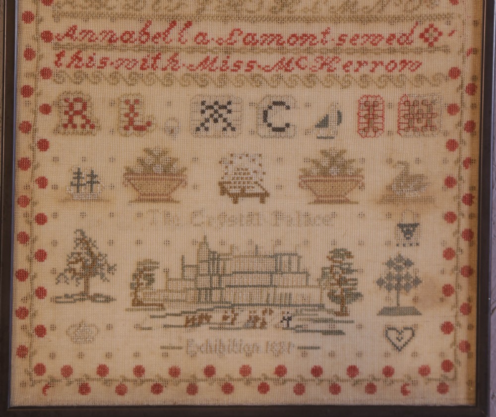 Framed 1851 Victorian needlework sampler featuring alphabets, numbers, and an embroidered depiction of the Crystal Palace on a linen ground. View III