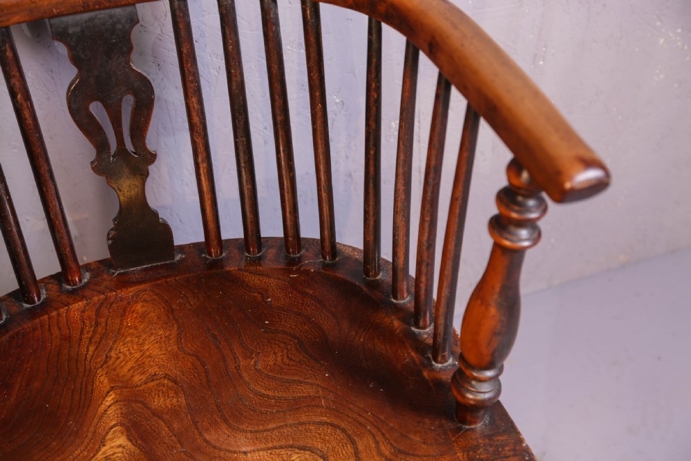 A high-back wooden Windsor armchair featuring a steam-bent hoop frame, a central pierced splat, turned legs, and a contoured elm saddle seat. View VIII