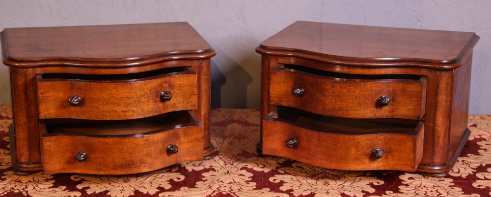 A pair of tiny Chest of drawers View II