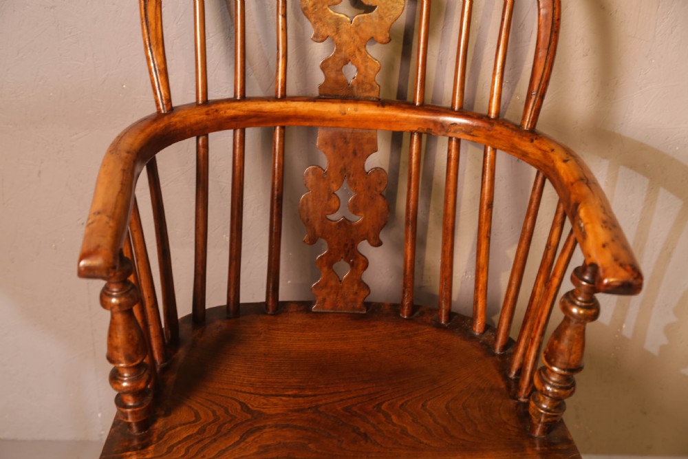 A low-back yew wood Windsor armchair featuring turned legs, a shaped saddle seat, a pierced burr splat, and a curved stretcher. View IV