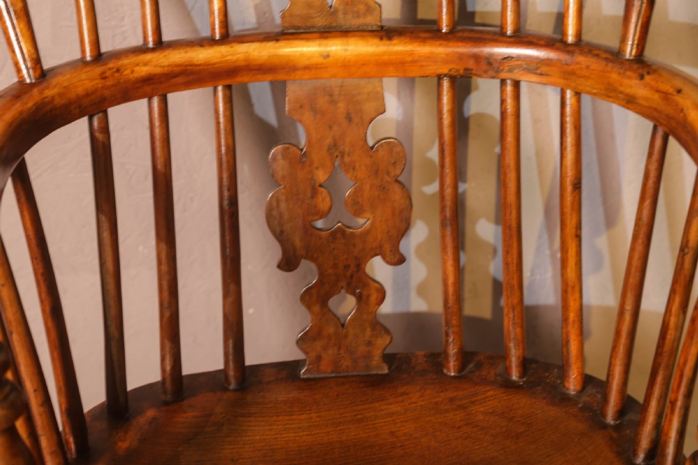 A low-back yew wood Windsor armchair featuring turned legs, a shaped saddle seat, a pierced burr splat, and a curved stretcher. View VIII