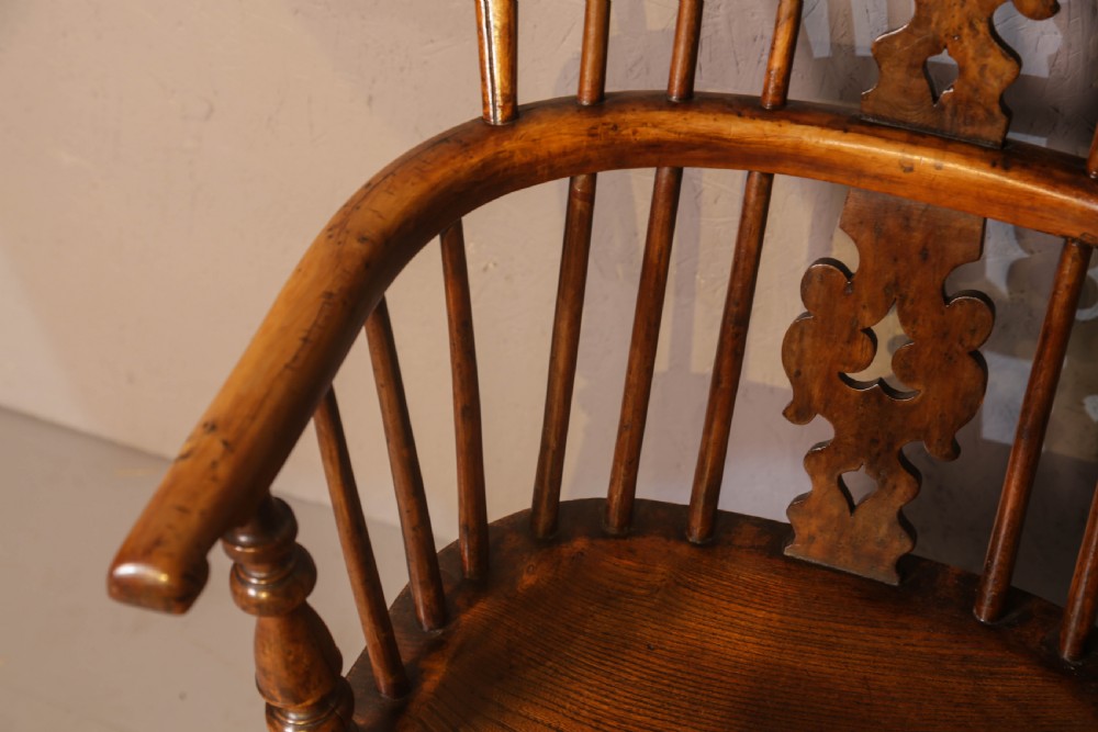 A low-back yew wood Windsor armchair featuring turned legs, a shaped saddle seat, a pierced burr splat, and a curved stretcher. View IX
