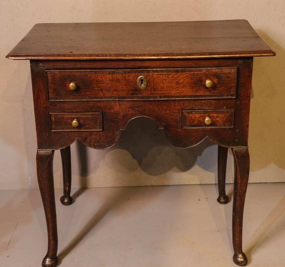 A Good early 18th century Low Boy in Oak, untouched very original