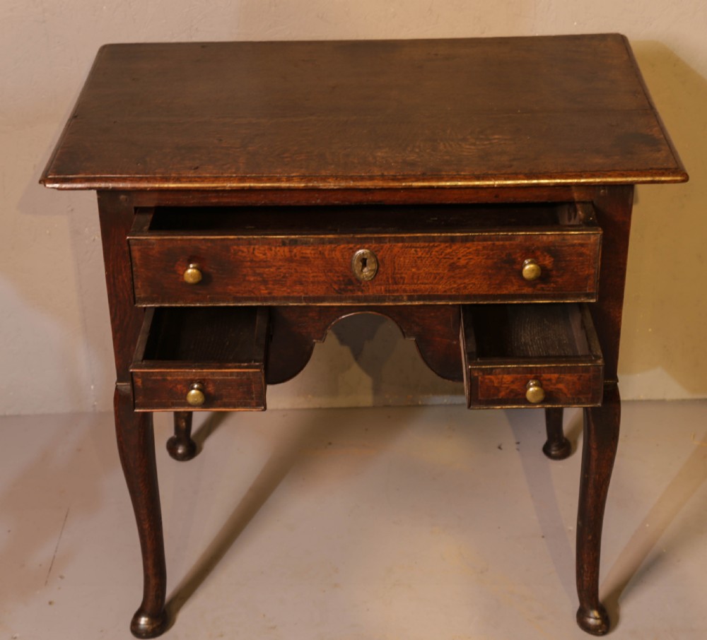 A Good early 18th century Low Boy in Oak, untouched very original View III