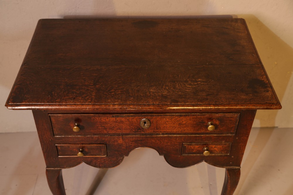 A Good early 18th century Low Boy in Oak, untouched very original View IV