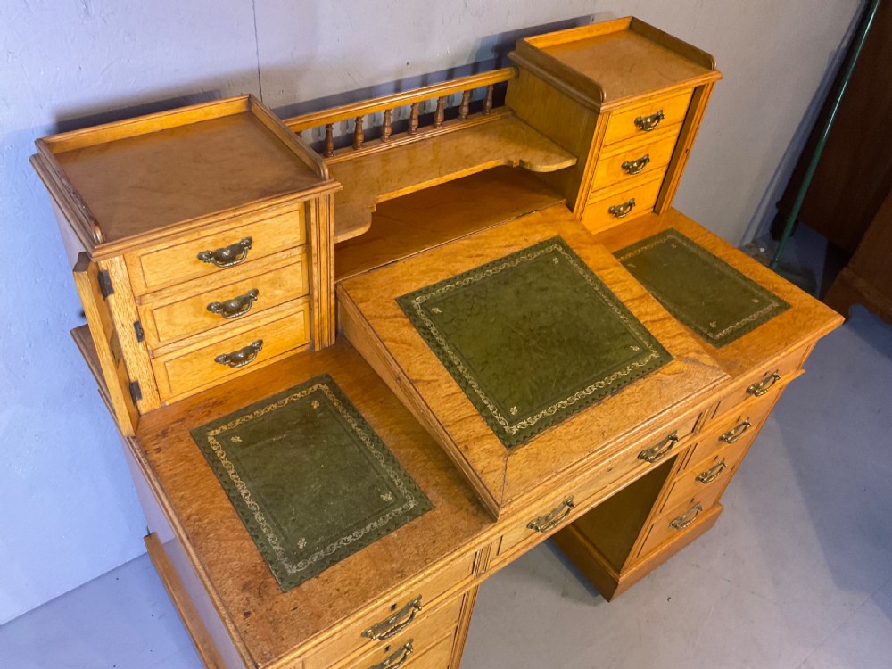 A good dickens desk in pale oak pedestal 3 parts View III