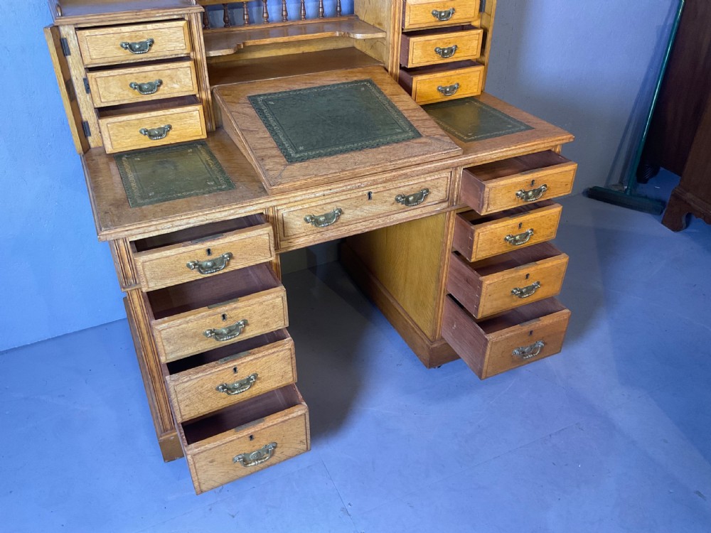 A good dickens desk in pale oak pedestal 3 parts View II