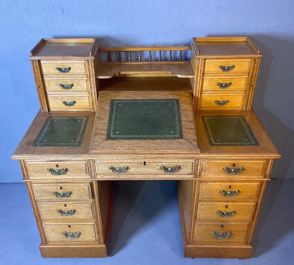 A good dickens desk in pale oak pedestal 3 parts
