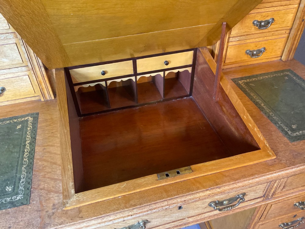 A good dickens desk in pale oak pedestal 3 parts View V