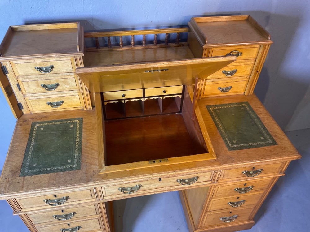 A good dickens desk in pale oak pedestal 3 parts View VIII