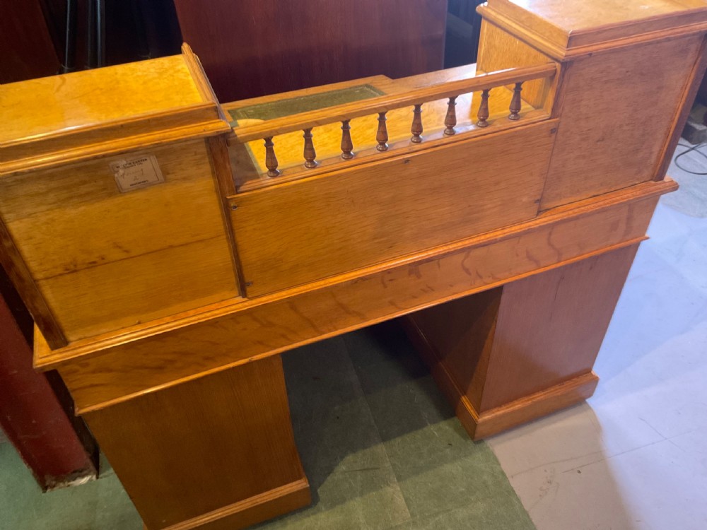 A good dickens desk in pale oak pedestal 3 parts View XI