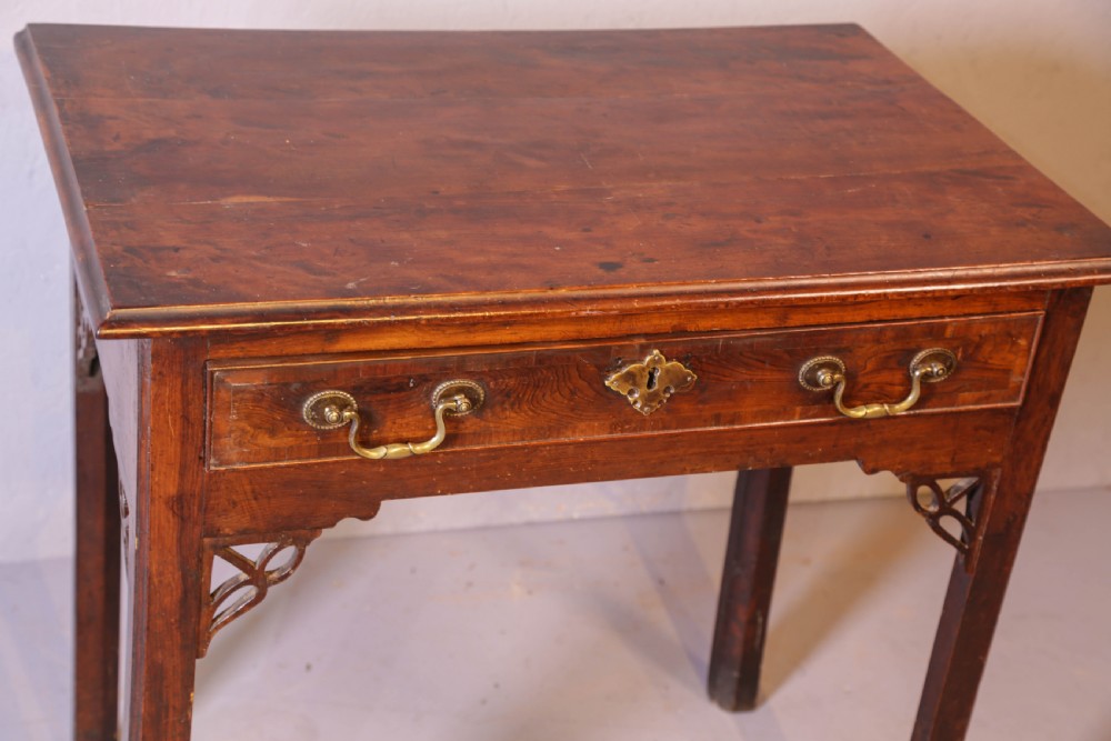 An 18th-century Georgian yew wood side table featuring a single drawer with brass handles, fretwork corner brackets, and straight square legs. View III