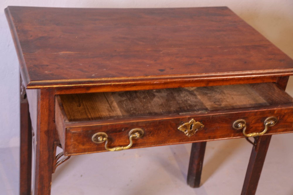 An 18th-century Georgian yew wood side table featuring a single drawer with brass handles, fretwork corner brackets, and straight square legs. View IV