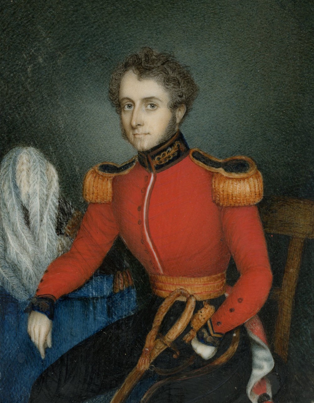An antique portrait miniature depicting a Dragoon officer in a red uniform with gold epaulettes, housed in a burl wood frame with a gilt inner sight edge. View II