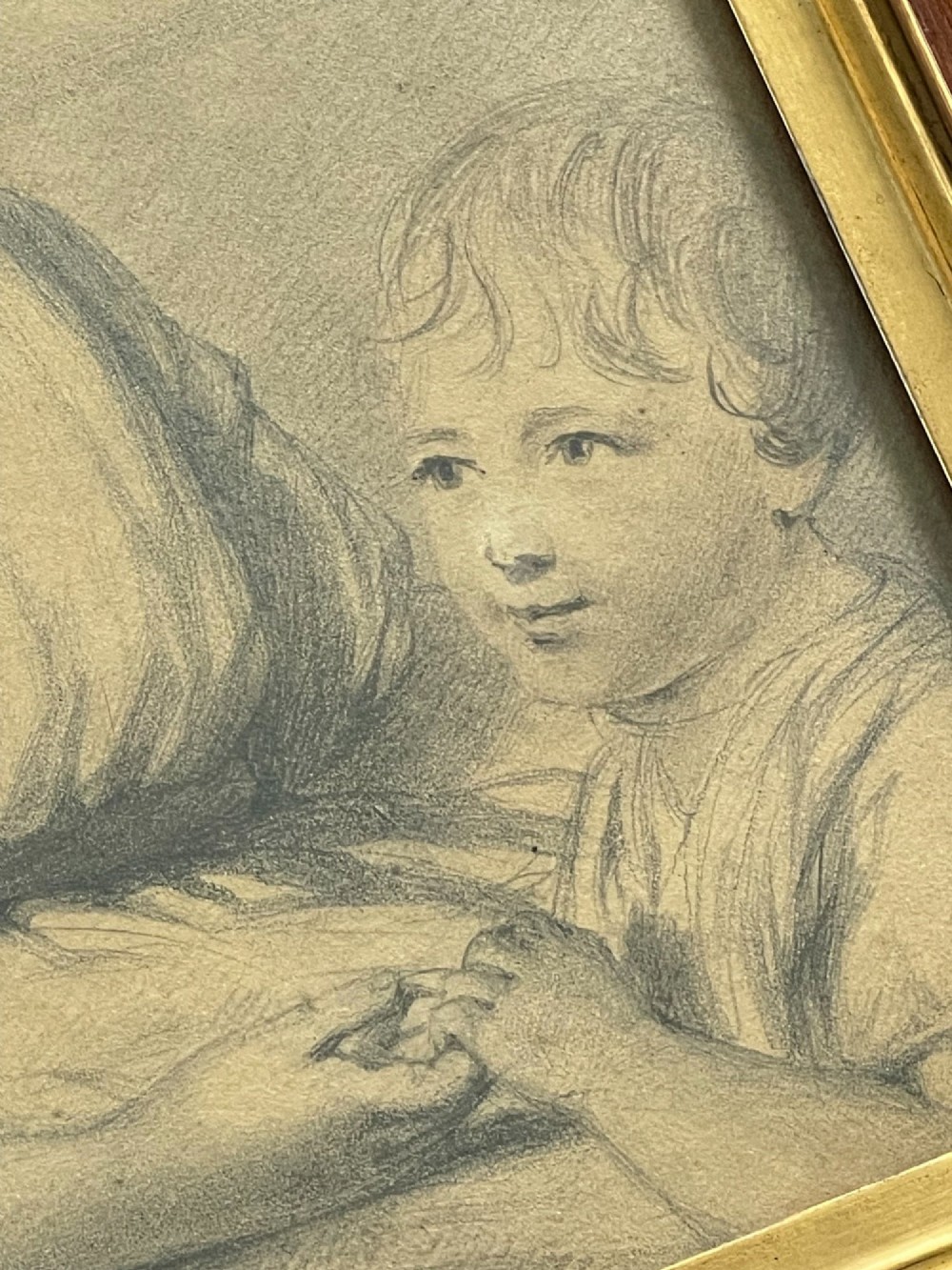 A pair of Regency era graphite portrait drawings framed in wide mahogany mouldings with gilded inner borders. View II