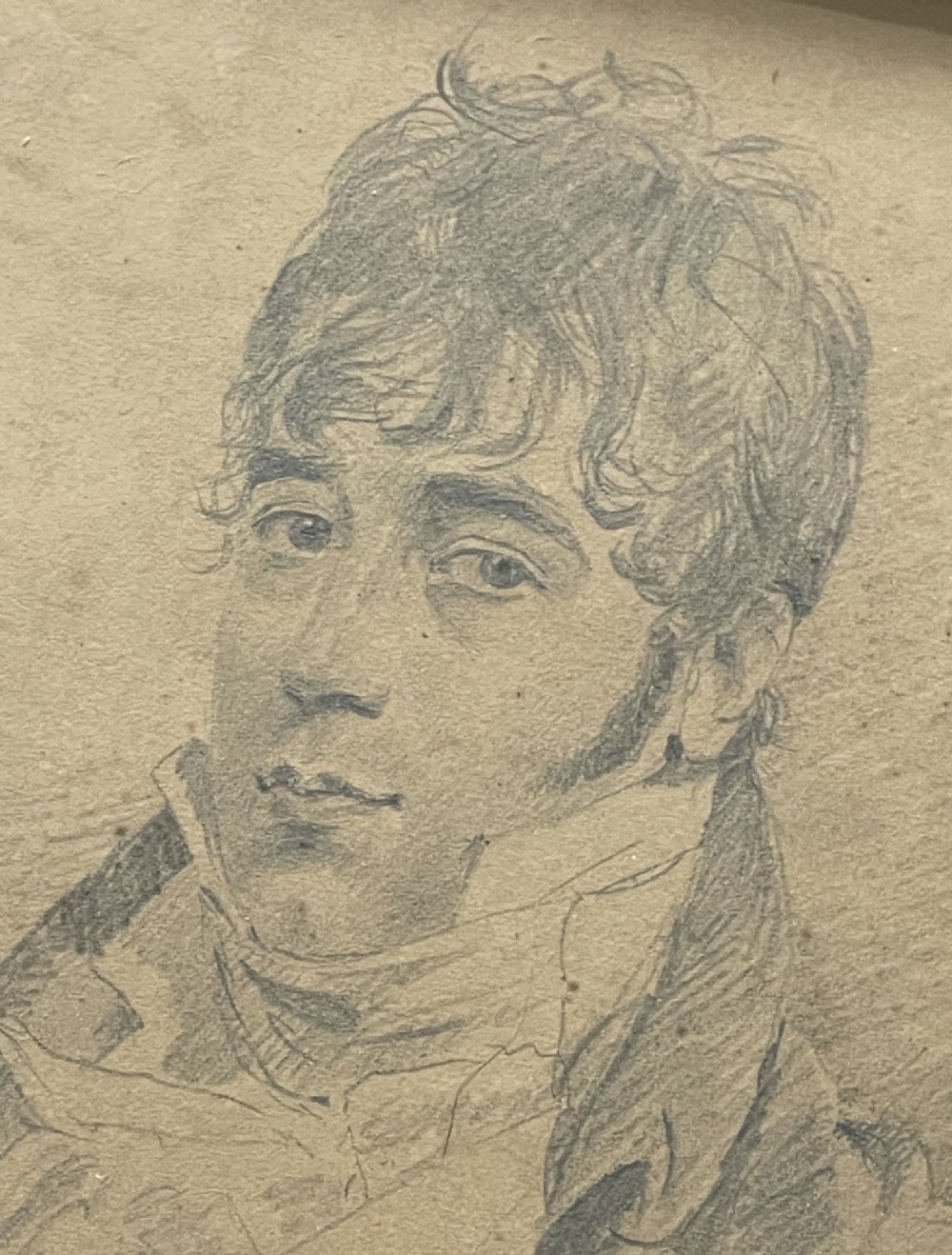 A pair of Regency era graphite portrait drawings framed in wide mahogany mouldings with gilded inner borders. View V