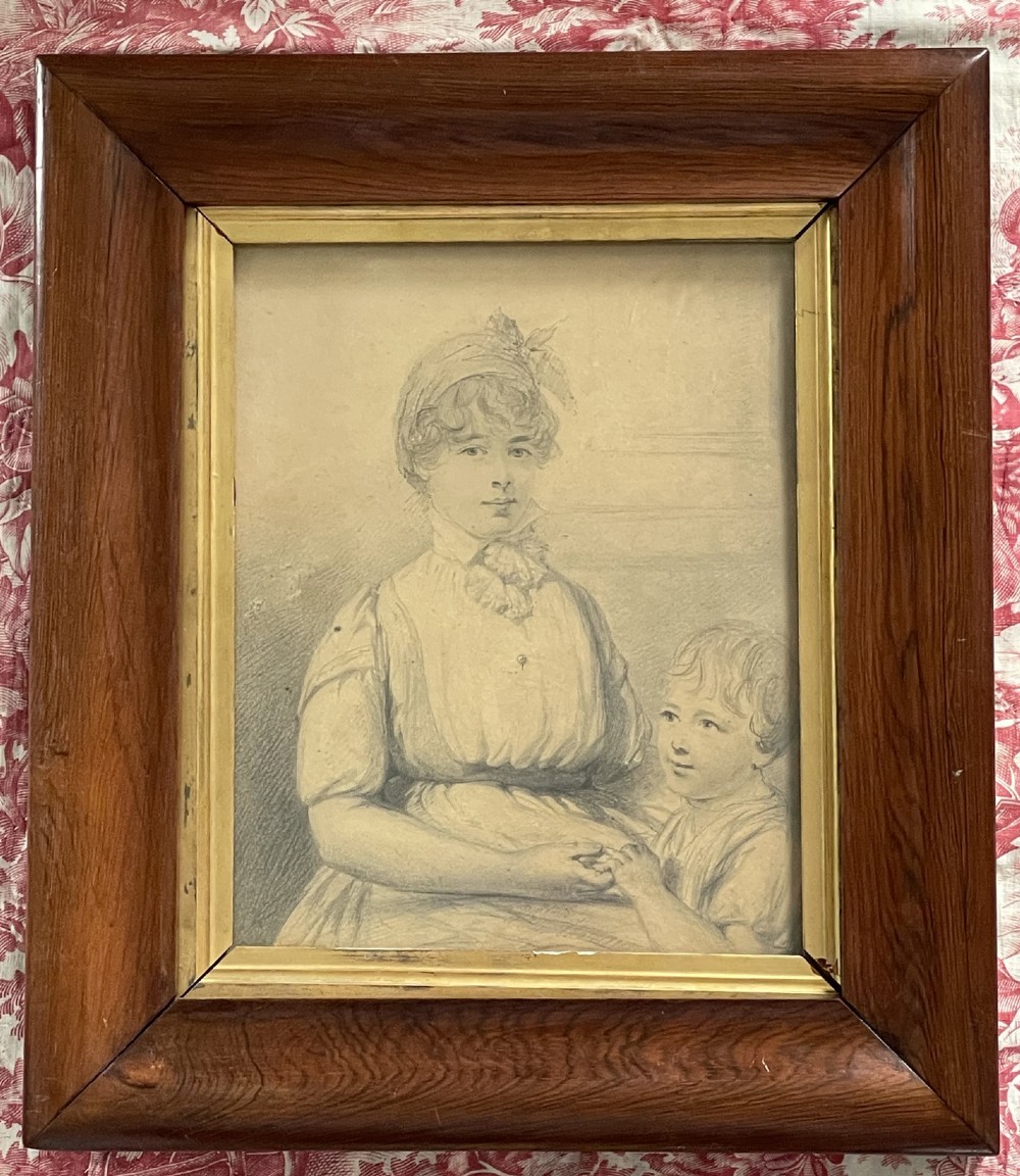 A pair of Regency era graphite portrait drawings framed in wide mahogany mouldings with gilded inner borders. View VI