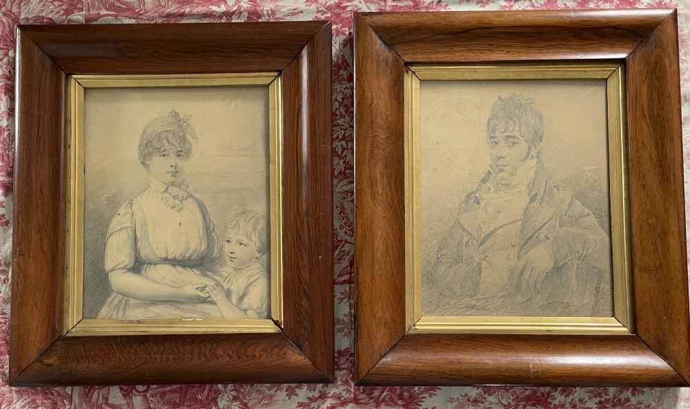 A pair of Regency era graphite portrait drawings framed in wide mahogany mouldings with gilded inner borders. View VIII