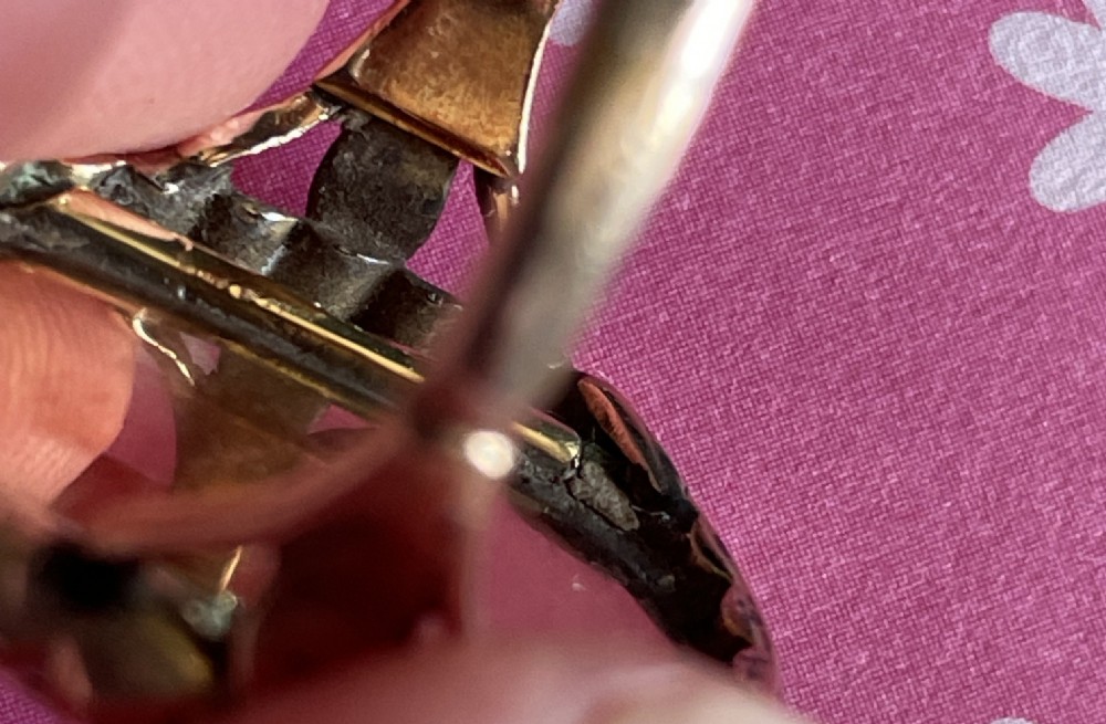 An antique Georgian oval ring featuring a reverse-painted verre eglomise silhouette portrait set within a beaded gold bezel. View VIII