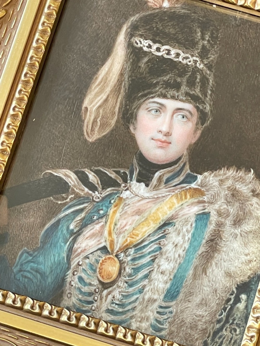 A framed portrait miniature depicting Lieutenant General Charles Vane-Stewart in a Hussar military uniform with a busby hat, set inside a heavily carved gold gilt frame. View IV