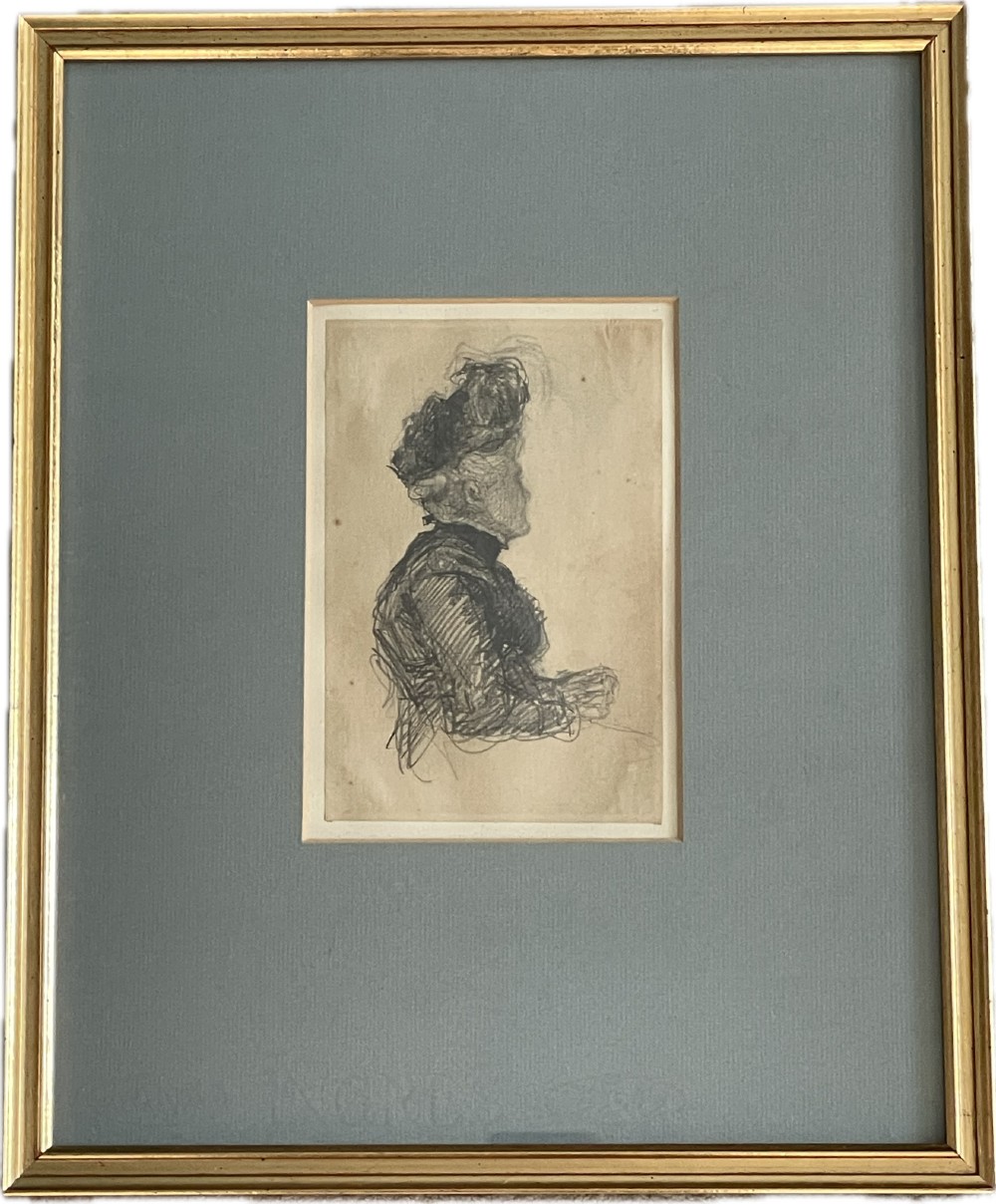 A framed antique profile drawing of a woman in an Edwardian hat, rendered in graphite on paper with a slate grey mount and slim gold gilt frame.