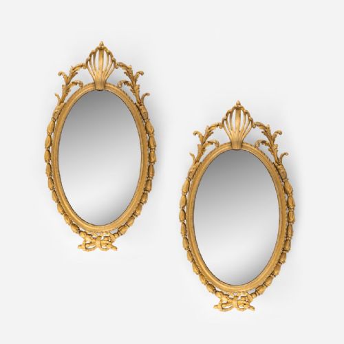 A Pair of 19th Century Chippendale Style Carved and Gild Mirrors