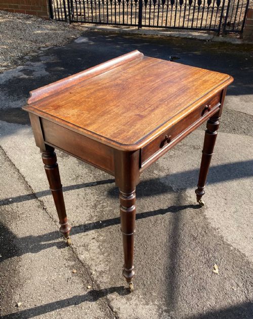 A Late Regency Period Mahogany Side or Writing Table