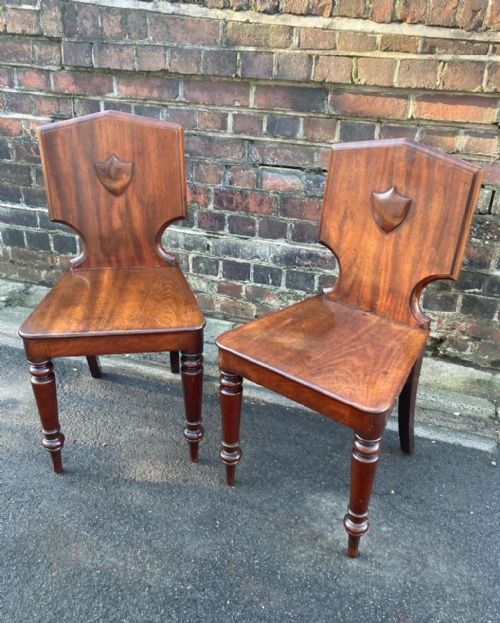 A Pair of Regency Period Hall Chairs