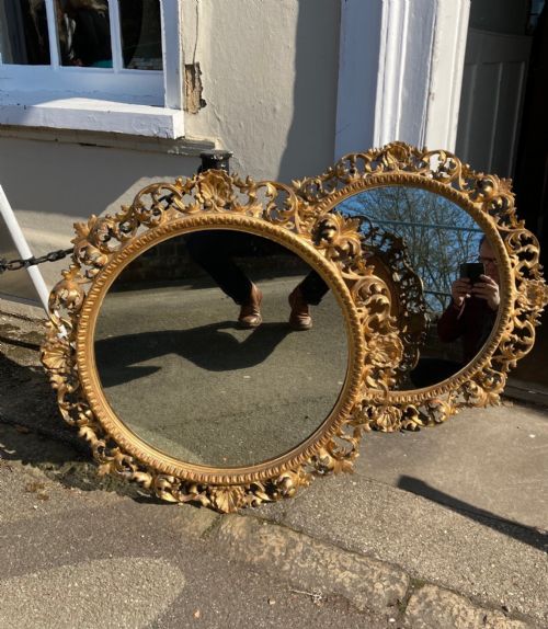 A Rare Pair of 19th Century Italian Carved Wood and Gilded Mirrors.