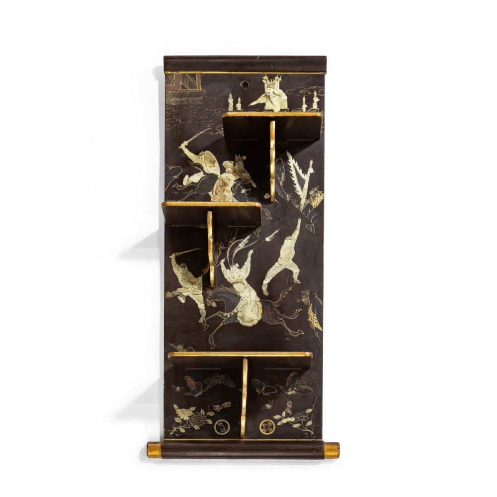 A 19th Century Chinese Export Lacquer Wall Shelf With Folding Shelves