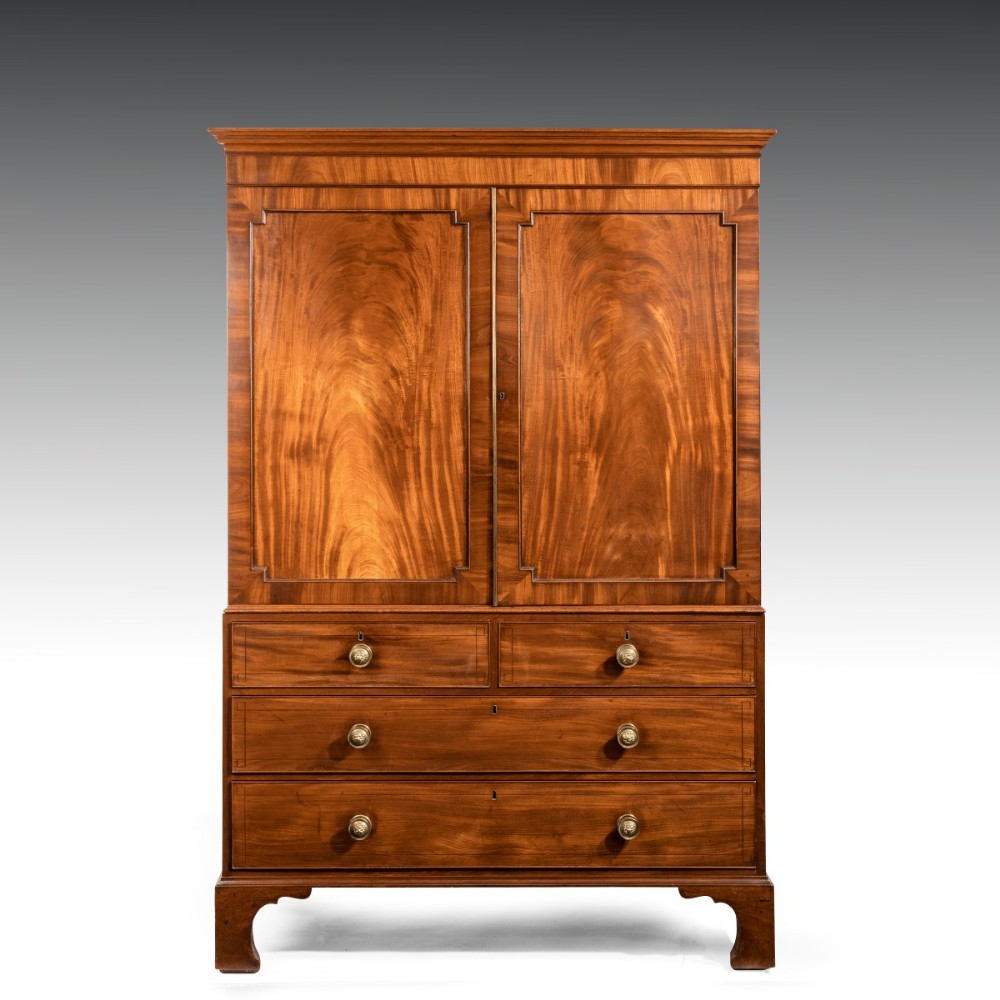 A Regency period linen press with original trays