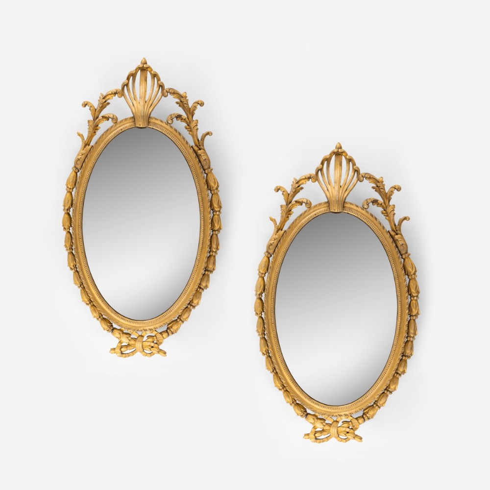 A Pair Of 19th Century Chippendale Style Carved And Gild Mirrors