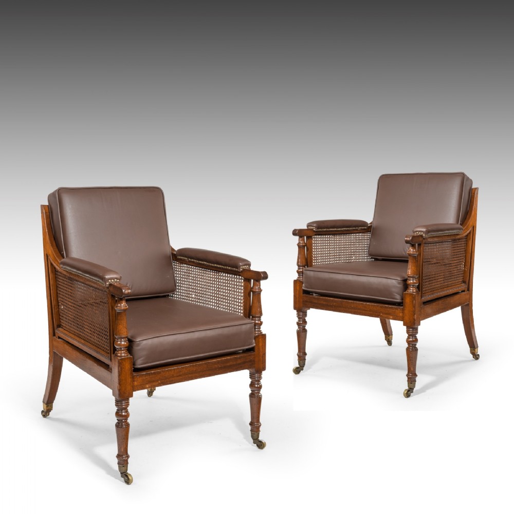 A Pair Of Regency Period Library Bergere Chairs